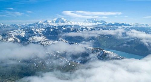 Clouds over high mountains, Mt Foraker and Mt Denali or Mount McKinley, aerial view, Alaska Range,