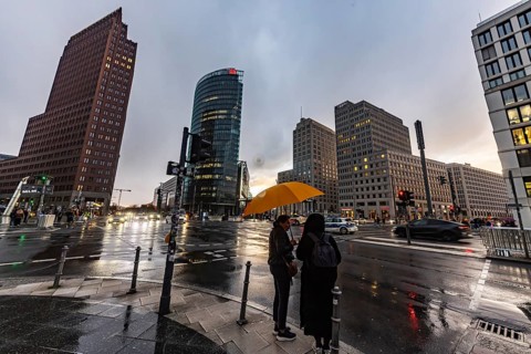 Potsdamer Platz Berlin in the evening with traffic on the streets. When it rains, the skyscrapers