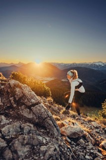 Trail running in autumn on the Jochberg on Lake Walchensee against the wonderful backdrop of the