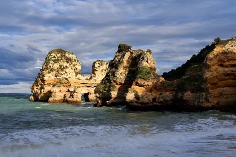 Rock formations on the coast in the evening light, Praia do Camilo, Lagos, Algarve, Portugal