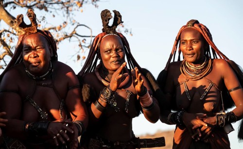 Himba woman dancing euphorically, traditional dance, traditional Himba village, Kaokoveld, Kunene,