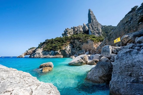 Light blue clear sea on a dream beach on Cala Goloritzé, picturesque rocky coast, steep coast with