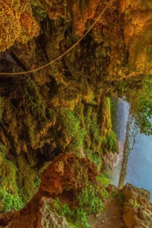 Interior of the Iris Grotto at the Cola de Caballo Waterfall in the Monasterio de Piedra Natural