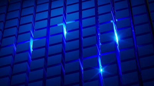 Cube structures create a captivating geometric arrangement highlighted by blue light, showcasing