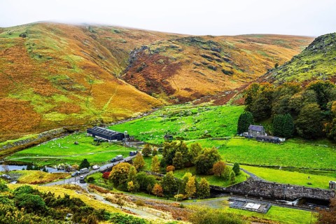 Autumn colors over Claerwen Dam, Claerwen Valley, Elan Valley Reservoir, Rhayader, Powys, Wales, UK