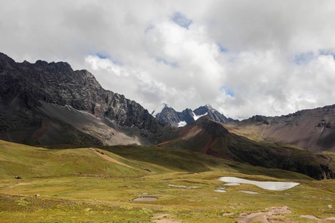 Captivating view of Ausangate mountain in the Andes of Peru, showcasing rugged peaks and serene