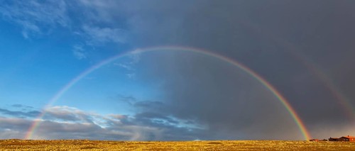 A complete beautiful rainbow in front of a stormy sky, Landscape, Finland, Varanger, Finnmark,