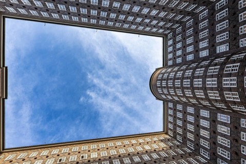 View of the sky in the courtyard of the Chilehaus in the Kontorhausviertel, Hamburg, Germany