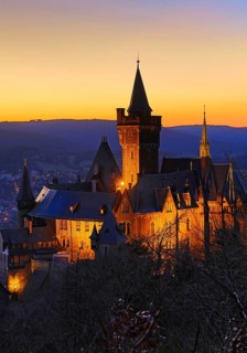 Atmospheric view of the illuminated Wernigerode Castle at sunset, Harz Mountains, Saxony-Anhalt,