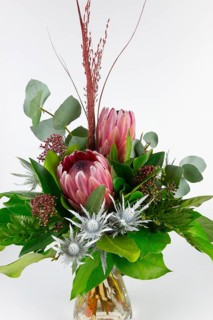 Natural-looking bouquet with protea and eucalyptus in harmonious colours, bouquet