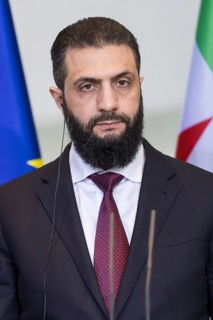 Ahmed al-Sharaa (President of the Syrian Arab Republic) at a joint press conference with Friedrich