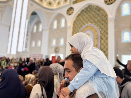 Dozens of Muslim children participate in indoor entertainment event inside a grand mosque during