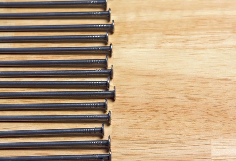 Macro of Nails on a Wood Background