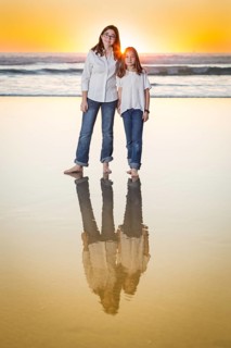 Two Young Sisters Portrait on The Beach