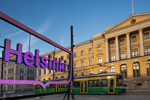Large pink glowing city logo of Helsinki, Snellmaninkatu, city center, state government office,