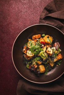 Warm Salad, Saksuka, with crispy eggplant, and tomatoes, spices, herbs, sesame seeds, sunflower