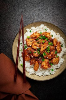 Fried chicken teriyaki with rice, green onion and sesame, homemade, no people