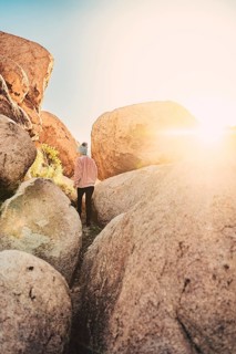 Woman hiking at sunrise in Joshua Tree National Park