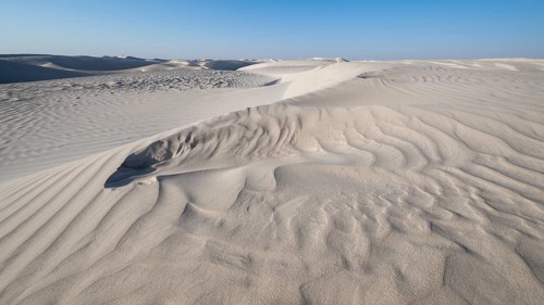 White sand dunes in the Khaluf Desert, Oman