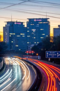 Evening traffic, partly with traffic jams, slow-moving traffic on the A40 motorway, Essen skyline,