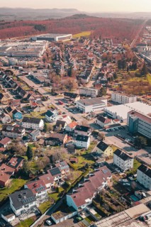 Aerial view of a sprawling suburban residential area with lots of greenery, Mühlacker, Enzkreis,