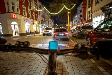 Cycling in the city, in the dark, in the evening, inner-city road, bicycle road, two-wheeler
