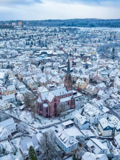 Aerial view of a wintry town with central church and snow-covered houses, Nagold, Black Forest,