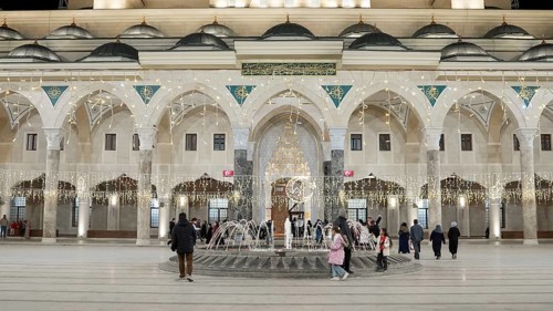 Muslims perform Tarawih prayers at the Millet Mosque, the second largest mosque in Turkey, which is