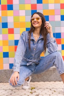 Young caucasian girl with a monkey cowboy in colored tiles. Enjoying the city on vacation, a young