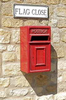 Red letterbox, house wall, Chipping Campden, The Cotswolds, England, Great Britain