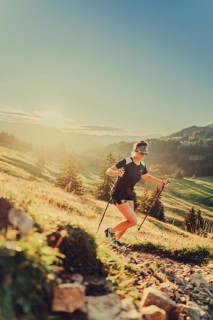 Summer trail running and hiking in the Alps on the Riedberg Pass between Obermaiselstein and
