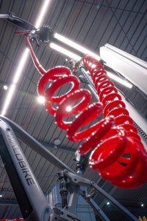 Red spiral cord in a modern illuminated bicycle workshop, Waldbike Manufaktur, bicycle workshop,