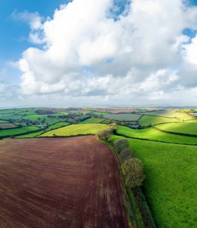 Panorama of Lights and Shadows over Fields and Farms from a drone, Devon, England, United Kingdom