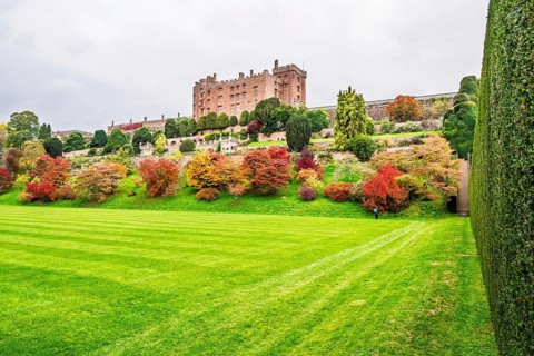 Autumn colors over Powis Castle and Garden, Welshpool, Powys, Wales, UK