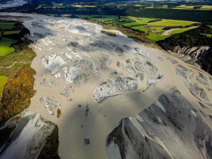 Aerial view of the braided Waimakariri River weaving through the rich farmland of Canterbury, New