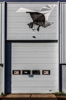 Street art Flight of a Man, outer wall of the former Keilewerf 1, M4H area, Merwe-Vierhavens,