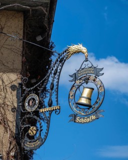 Wrought iron nose sign of the wine bar, restaurant Schäpfle in the historic old town of Überlingen