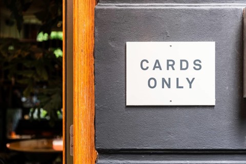 Cards Only sign at the entrance of a restaurant in Utrecht, Netherlands
