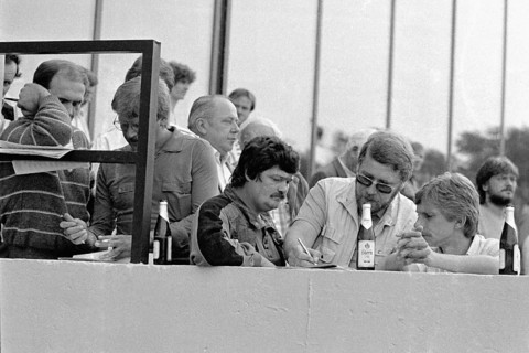 Gelsenkirchen, DEU, 1983 - Men fill out tips for a horse race at the trotting track in