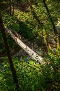 Scenic view of a wooden suspension bridge crossing the tolmin gorges in slovenia, surrounded by