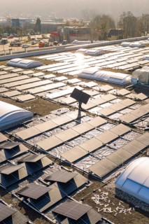 Detailed view of solar panels under sunlight on a modern building roof, PV Bau Auf OBI Bau Markt,