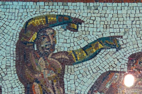 Detailed mosaic with a figure showing by hand, Museum of the History of the Ancient Olympic Games,