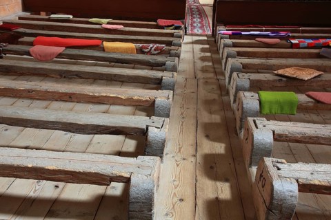 Pews, interior of the fortified church in Honigberg, Harman, Burzenland in Transylvania, Romania