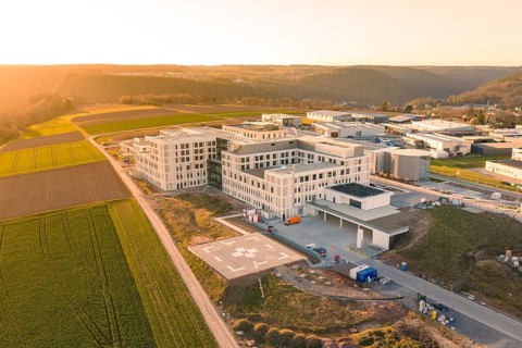 Hospital building complex in an industrial area at sunset, new hospital at Klinik Verbund Südwest,