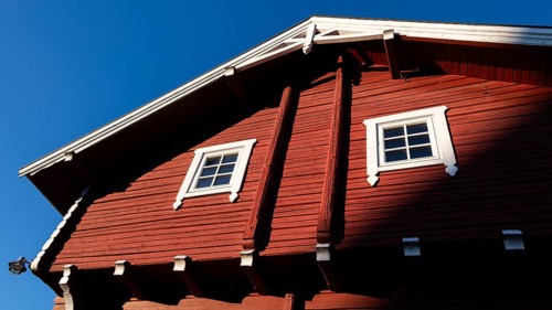 Upper part, falun red painted, traditional Norwegian wooden granary or Stabbur, pilgrim hostel