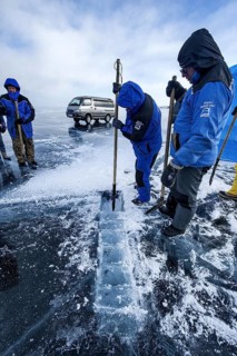 Digging a hole in ice for scuba divers, Lake Baikal, Pribaikalsky National Park, Irkutsk Province,