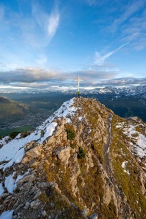 Summit cross at the summit of the Kramerspitz, at sunset, in autumn, Ammergau Alps, in autumn,