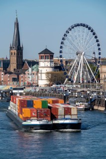 Container freighter, Milliennium II, as a coupling unit, on the Rhine, on the banks of the old