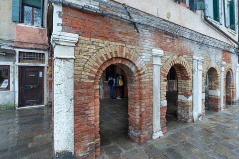 Historic arcades on Campo del Ghetto Nuovo, Venice, Veneto, Italy