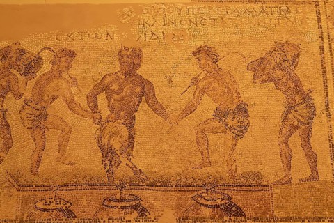 Mosaic depicting the pressing of grapes, ancient mosaic with several human figures in motion,